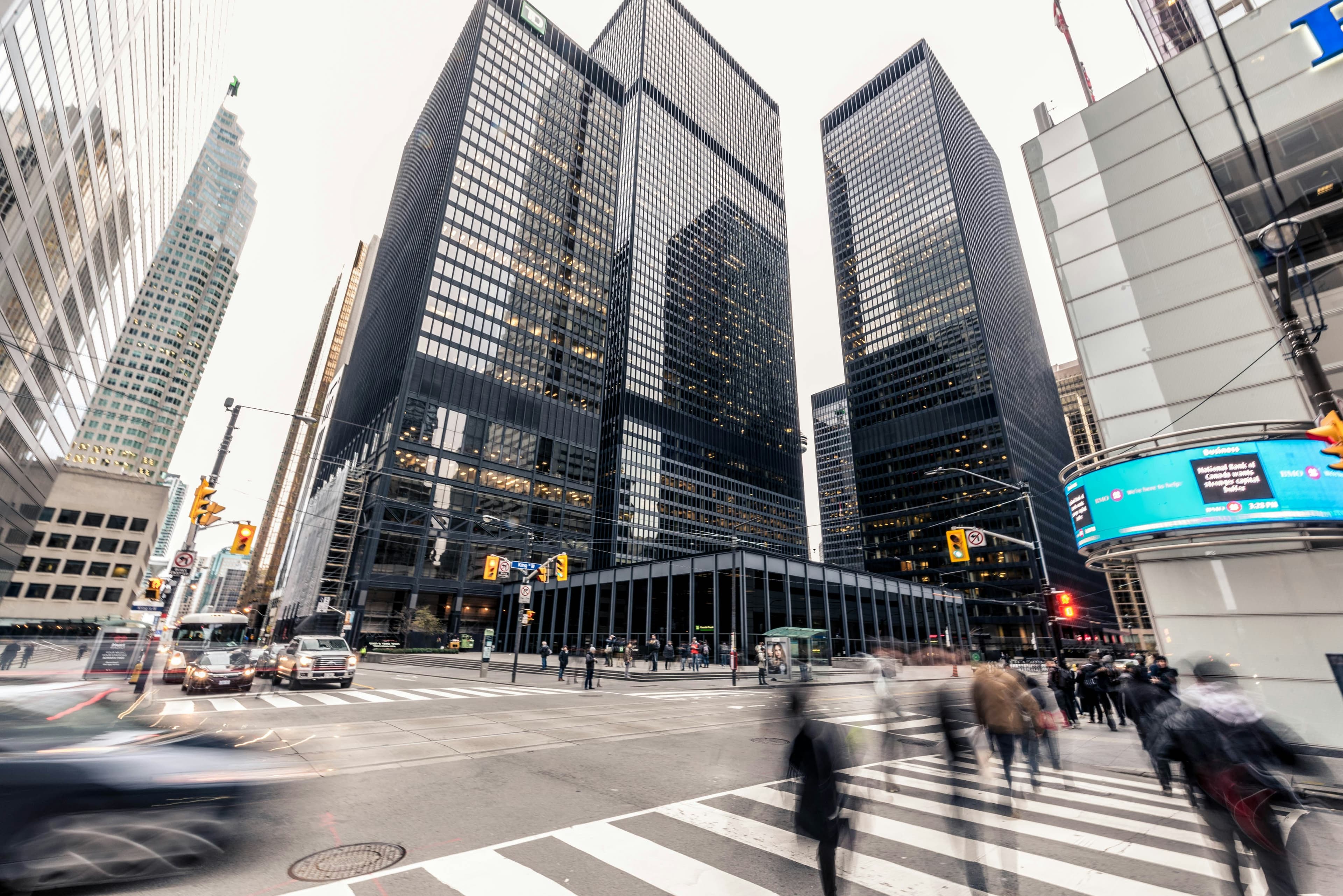 City financial district at dusk, representing regulated and operational businesses
